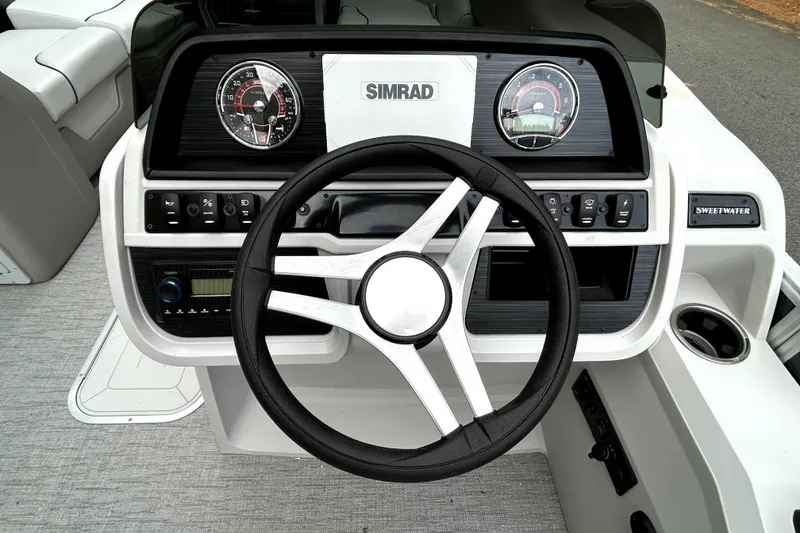 Slide: The Image of Steering console of 2026 Godfrey Sweetwater 2286 SFLC with Simrad display and controls. - 5