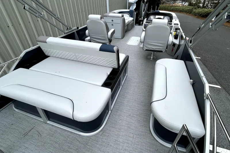 Slide: The Image of 2026 Godfrey Sweetwater 2286 SFLC pontoon boat interior with plush seating and modern helm. - 8