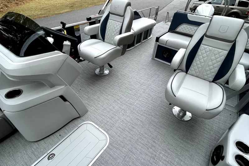 Slide: The Image of 2026 Godfrey Sweetwater 2286 SFLC pontoon boat interior with plush seating and modern design. - 9