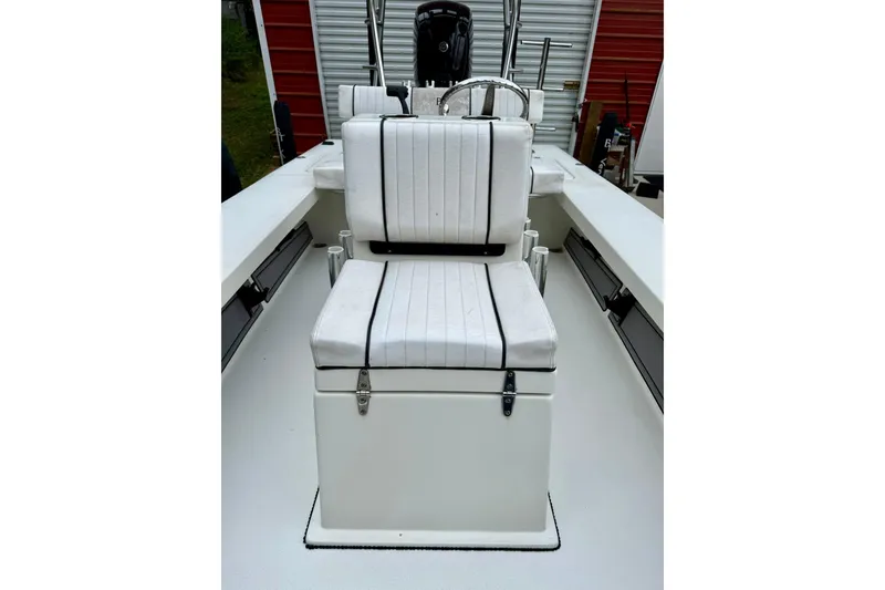 Slide: The Image of 2020 Beavertail Skiffs Vengeance boat interior with white cushioned seating. - 12