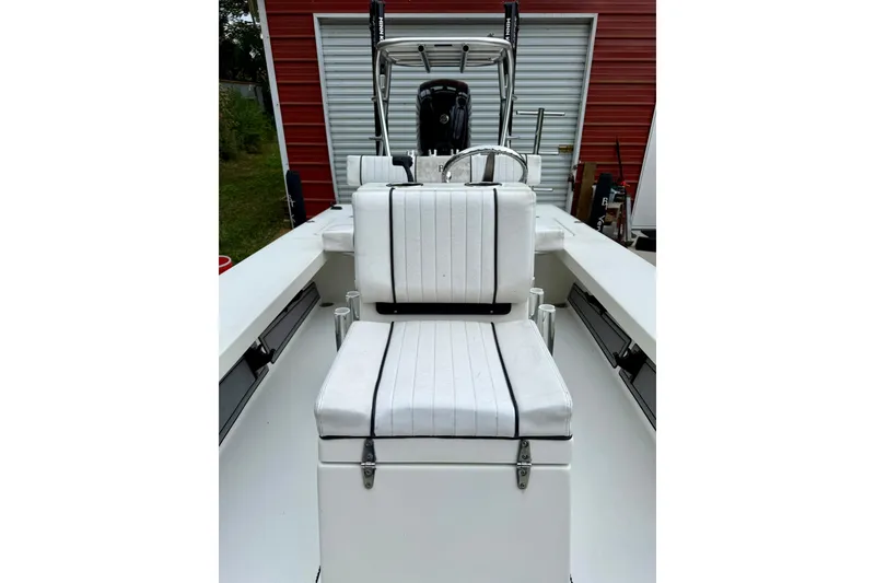 Slide: The Image of 2020 Beavertail Skiffs Vengeance boat interior with white seating and steering console. - 13