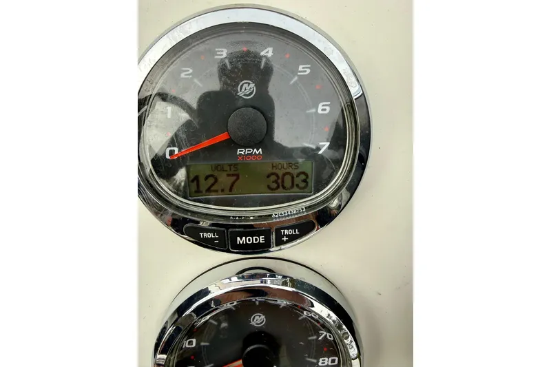 Slide: The Image of Close-up of 2020 Beavertail Skiffs Vengeance dashboard gauges displaying RPM, volts, and hours. - 15
