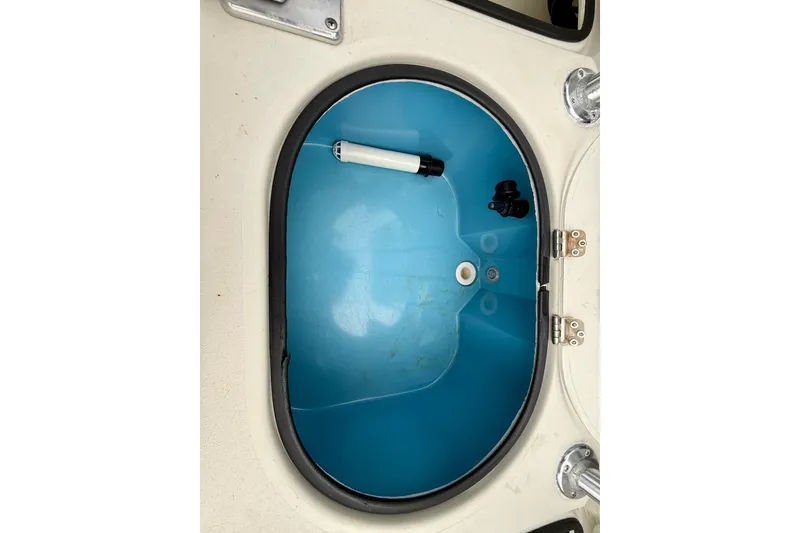Slide: The Image of 2020 Beavertail Skiffs Vengeance livewell interior with blue lining and fittings. - 17
