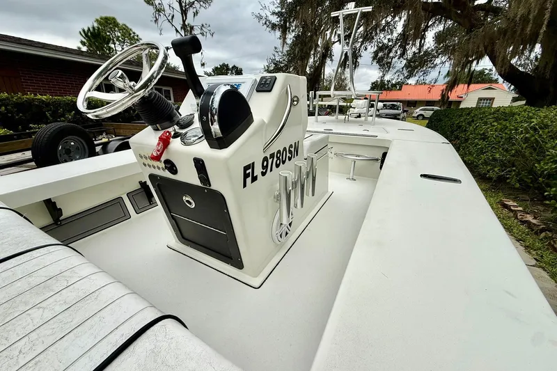 Slide: The Image of 2020 Beavertail Skiffs Vengeance boat with steering console, parked outdoors. - 19