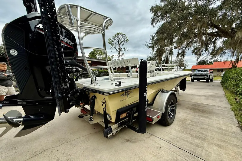 Slide: The Image of 2020 Beavertail Skiffs Vengeance boat on trailer, featuring Mercury outboard motor. - 2