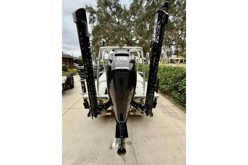 Slide: The Image of 2020 Beavertail Skiffs Vengeance with Mercury 115 outboard motor, parked on driveway. - 20