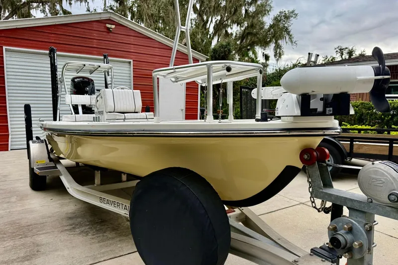 Slide: The Image of 2020 Beavertail Skiffs Vengeance boat on trailer, parked near red garage. - 3