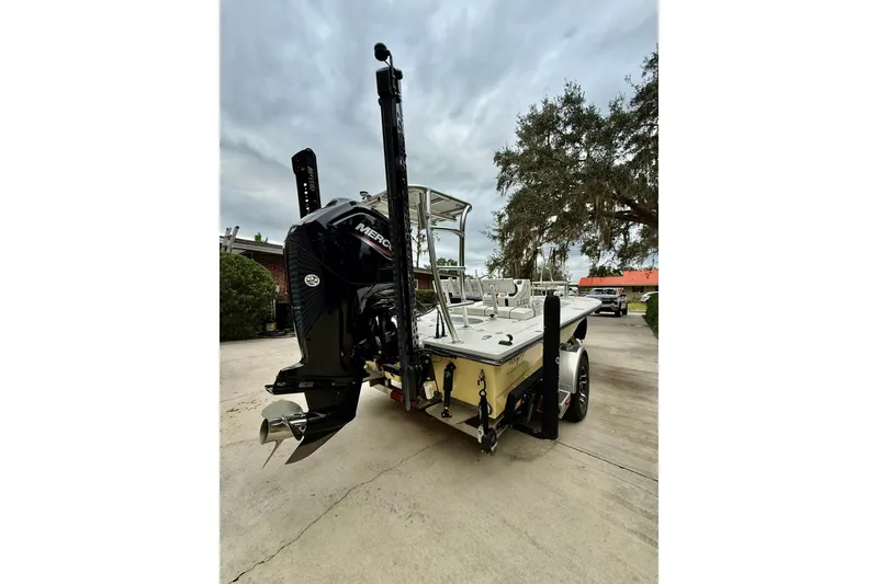 Slide: The Image of 2020 Beavertail Skiffs Vengeance boat with Mercury engine on trailer, parked outdoors. - 7