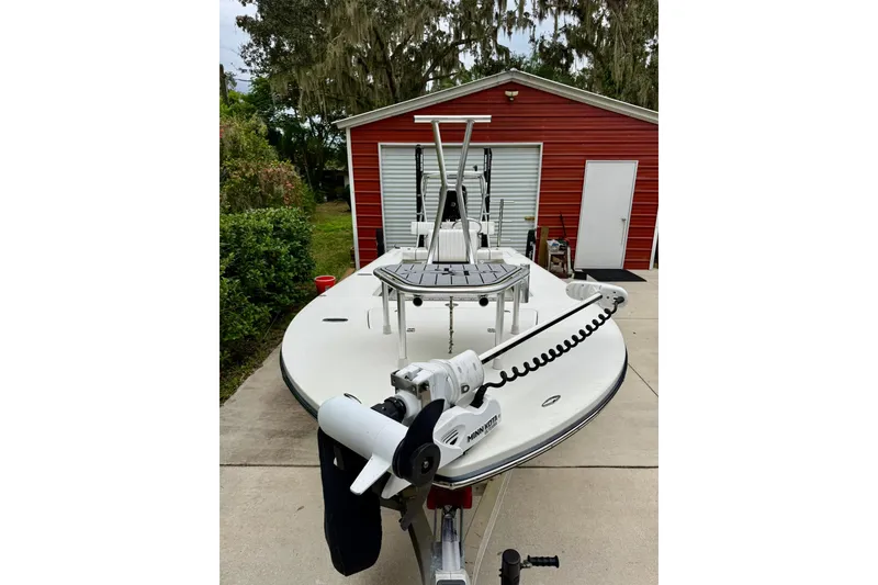 Slide: The Image of 2020 Beavertail Skiffs Vengeance boat parked in front of a red garage. - 8