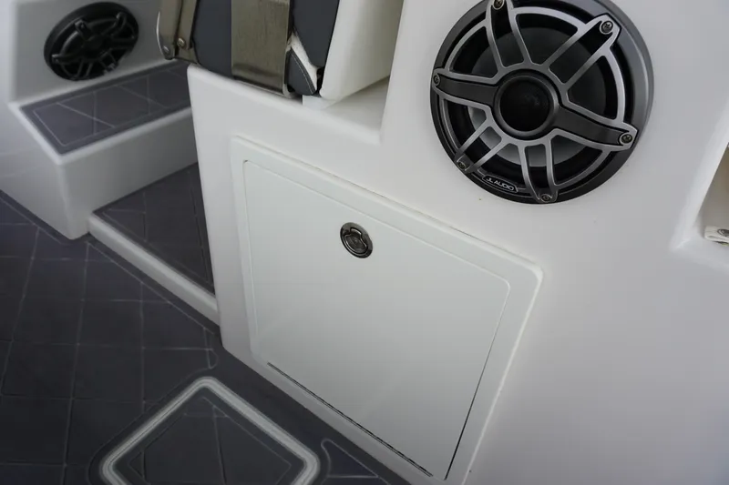 Slide: The Image of 2023 Insetta 35IFC boat interior with speaker and storage compartment. - 12