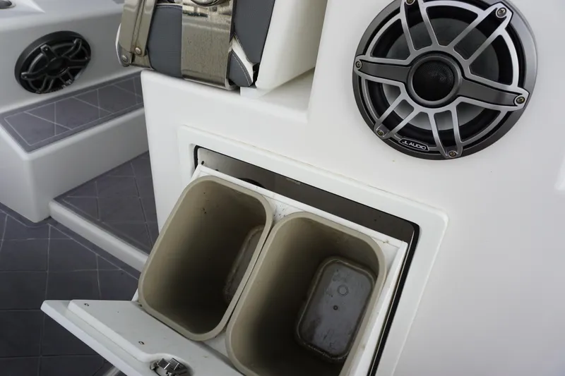 Slide: The Image of 2023 Insetta 35IFC boat interior with JL Audio speaker and storage compartments. - 15