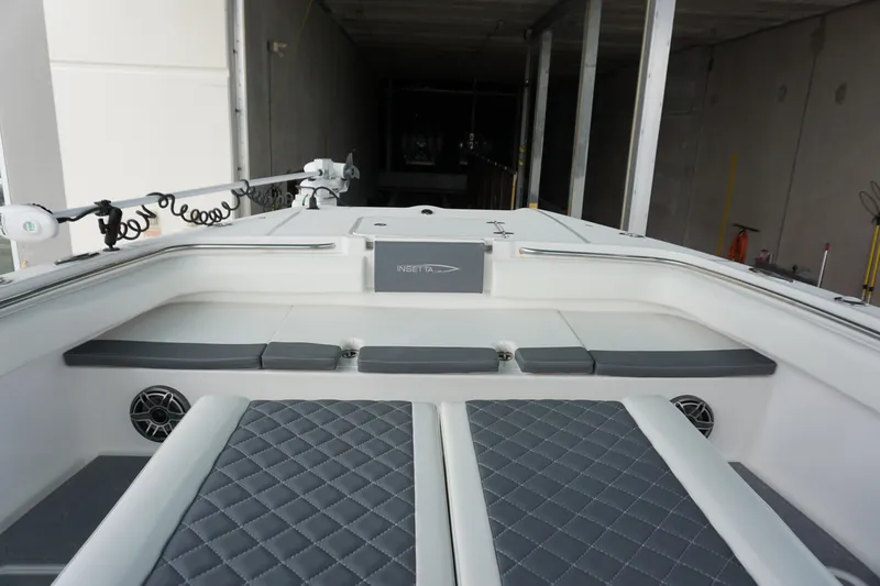 Slide: The Image of 2023 Insetta 35IFC boat interior with cushioned seating and modern design. - 23