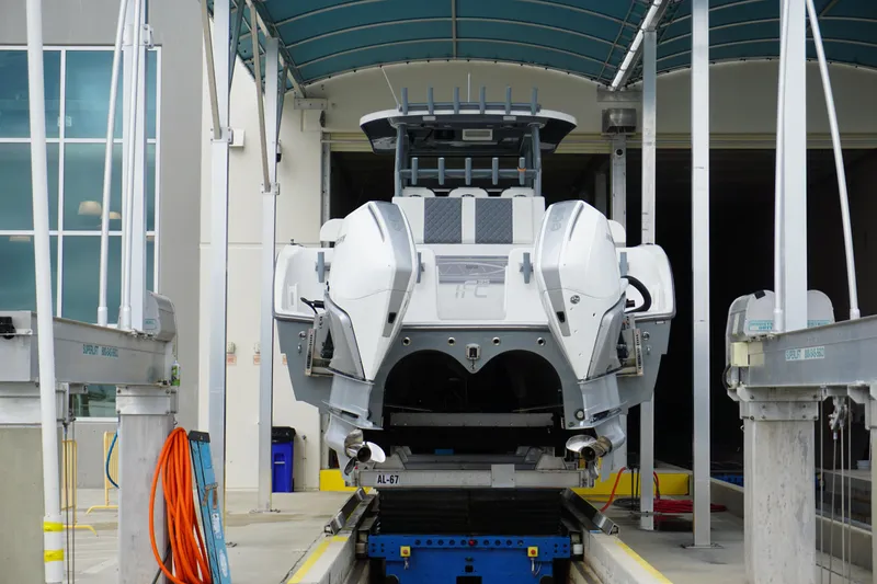 Slide: The Image of 2023 Insetta 35IFC boat in a covered dock, rear view. - 3