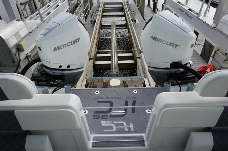 Slide: The Image of 2023 Insetta 35IFC boat with dual Mercury outboard engines at dock. - 4