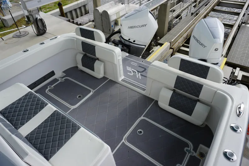 Slide: The Image of 2023 Insetta 35IFC boat interior with quilted seating and Mercury outboard engines. - 7
