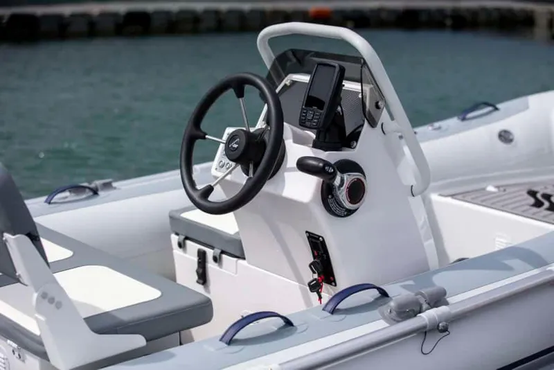 Slide: The Image of Manufacturer Provided Image: 2025 Highfield Classic 380 boat interior with steering wheel and controls. - 3
