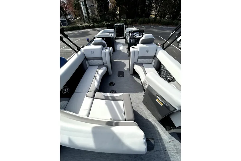 Slide: The Image of 2026 Godfrey Monaco 235 ULC pontoon boat interior with luxurious seating and modern design. - 11