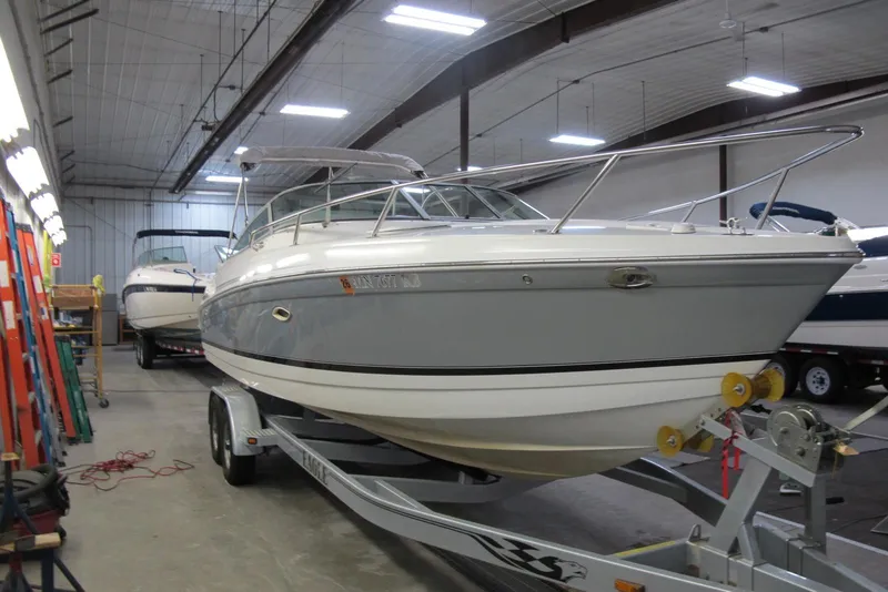 Slide: The Image of 2004 Formula 260 Sun Sport boat on trailer in indoor storage facility. - 1