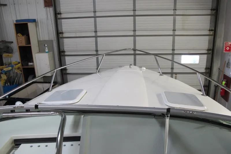 Slide: The Image of 2004 Formula 260 Sun Sport boat in a garage, viewed from the bow. - 3