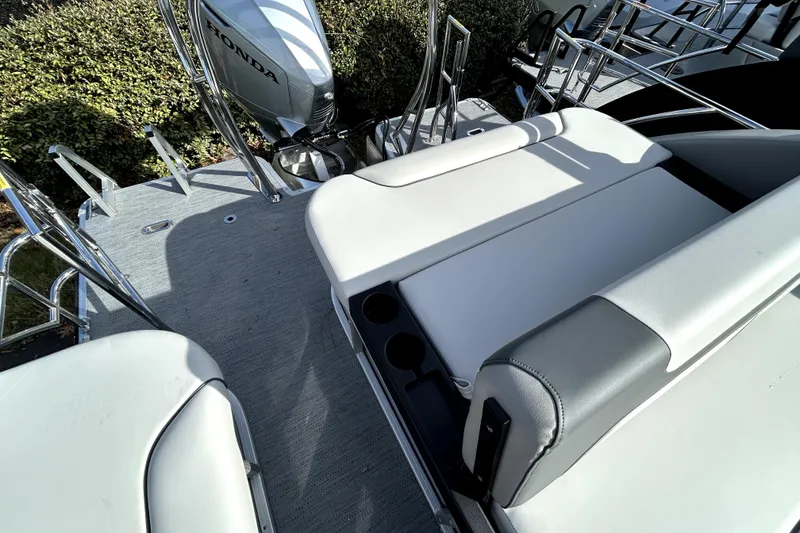 Slide: The Image of 2026 Godfrey Sweetwater 2286 SFL boat interior with seating and Honda motor. - 3