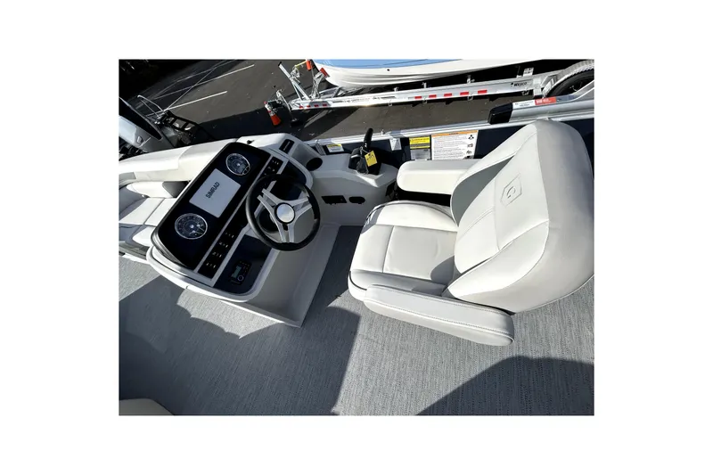 Slide: The Image of Interior of 2026 Godfrey Sweetwater 2286 SFL boat, featuring steering console and captain's chair. - 5