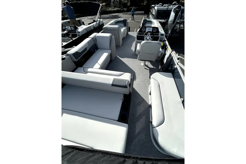 Slide: The Image of 2026 Godfrey Sweetwater 2286 SFL pontoon boat interior with spacious seating and modern helm. - 6