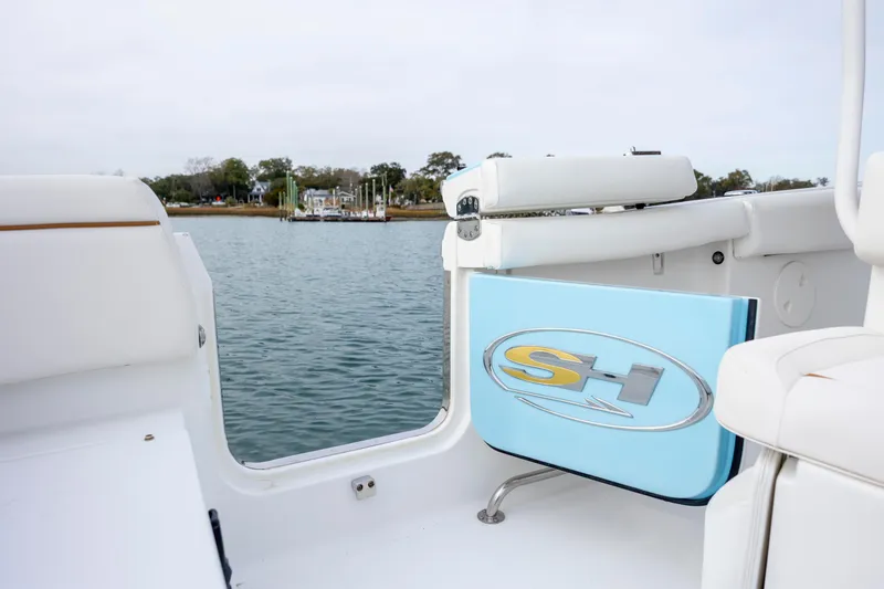 Slide: The Image of 2018 Sea Hunt Ultra 255 SE boat interior with water view. - 11