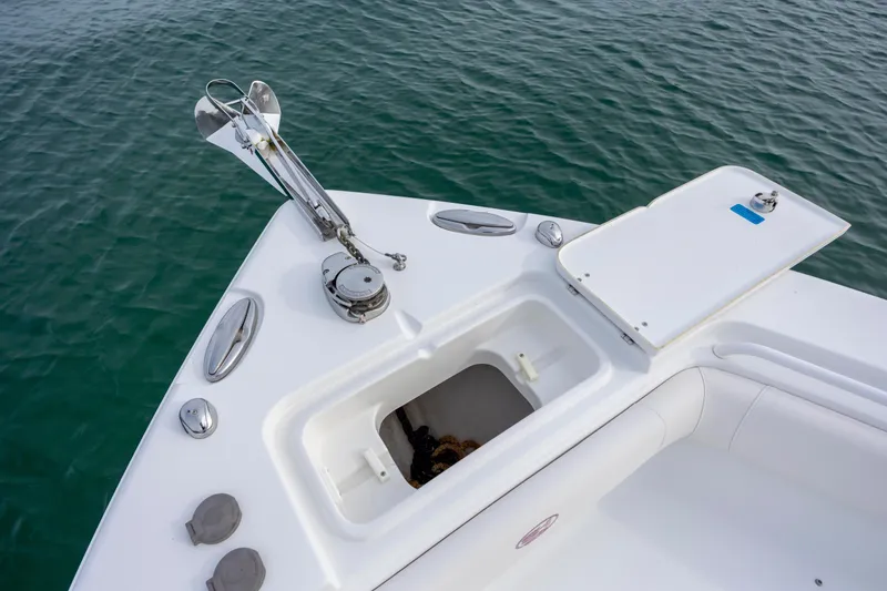 Slide: The Image of Bow of 2018 Sea Hunt Ultra 255 SE boat with anchor and storage compartment. - 19