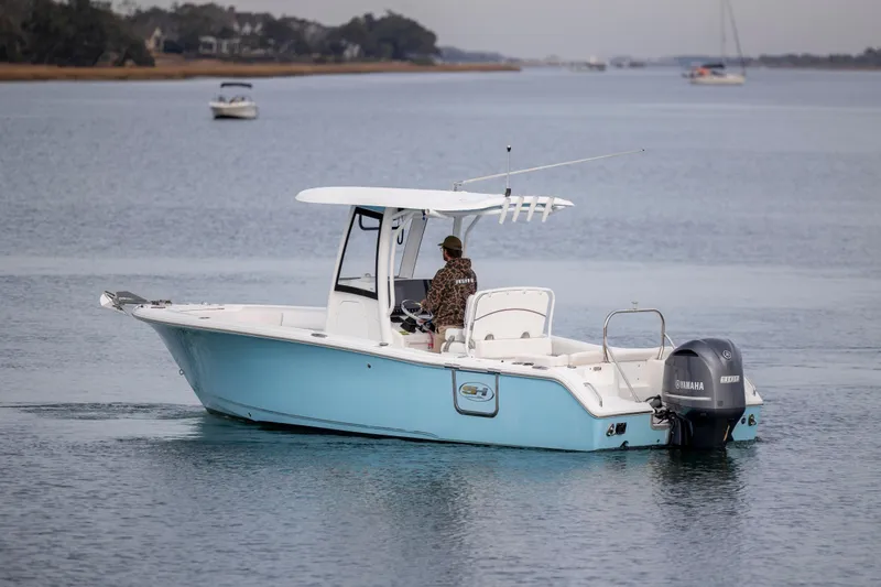 Slide: The Image of 2018 Sea Hunt Ultra 255 SE boat on calm water with Yamaha engine. - 3