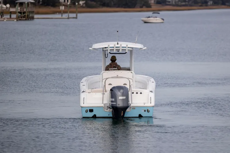 Slide: The Image of 2018 Sea Hunt Ultra 255 SE boat cruising on calm water. - 4