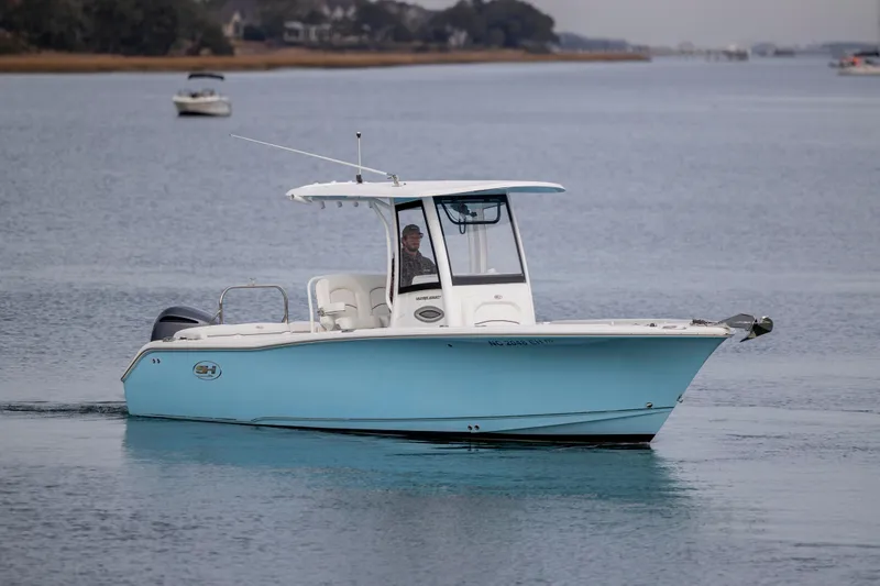 Slide: The Image of 2018 Sea Hunt Ultra 255 SE boat cruising on calm waters. - 7