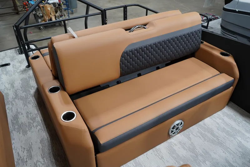 Slide: The Image of Sylvan L-3 ULZ 2026 boat seat with brown upholstery and cup holders. - 8