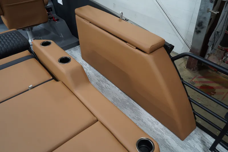 Slide: The Image of Interior of a 2026 Sylvan L-3 ULZ with brown leather seating. - 11