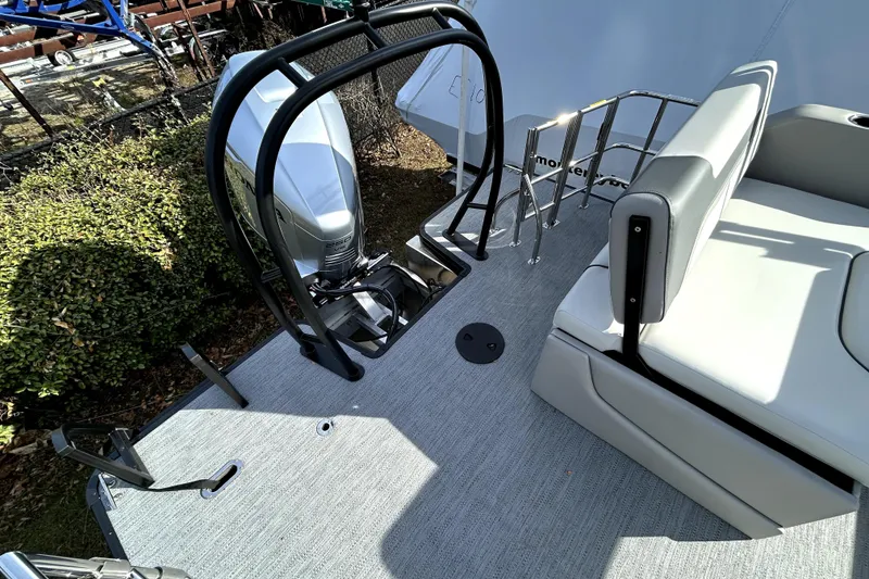 Slide: The Image of 2026 Godfrey SWEETWATER 2486 DT boat deck with seating and motor. - 4