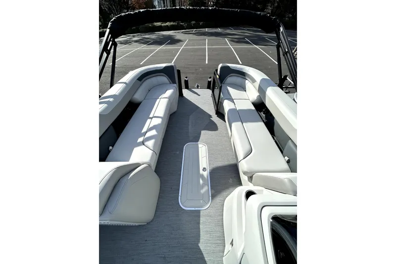 Slide: The Image of 2026 Godfrey SWEETWATER 2486 DT boat interior with spacious seating and modern design. - 6