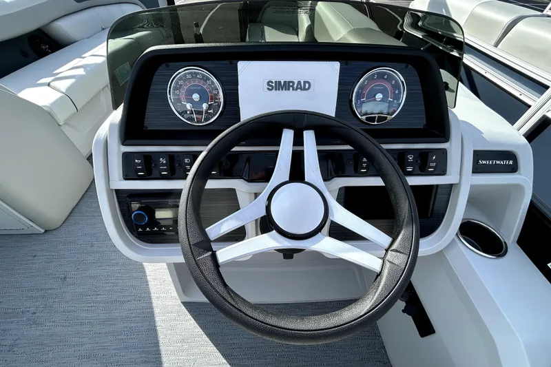 Slide: The Image of Steering console of 2026 Godfrey SWEETWATER 2486 DT boat with Simrad display. - 7