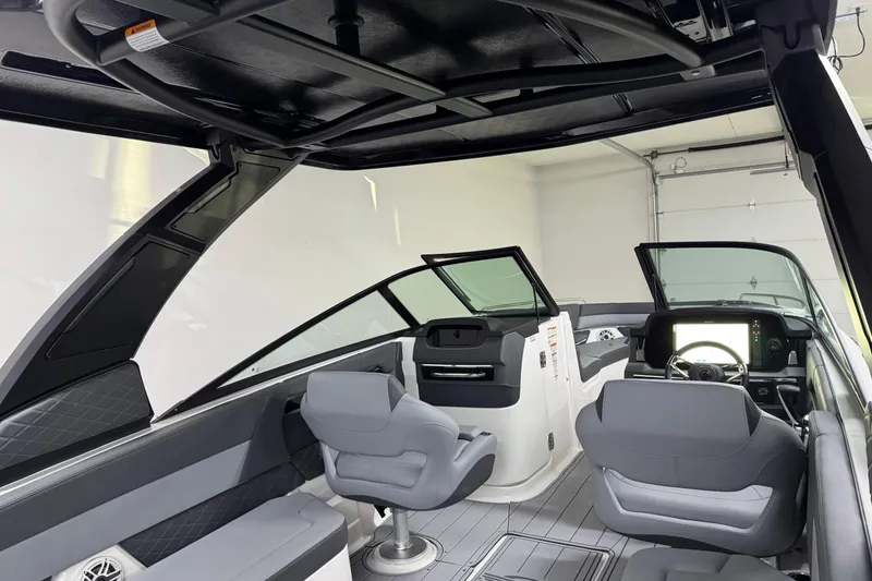 Slide: The Image of Interior of 2026 Chaparral SSX 30 boat with modern seating and dashboard. - 11
