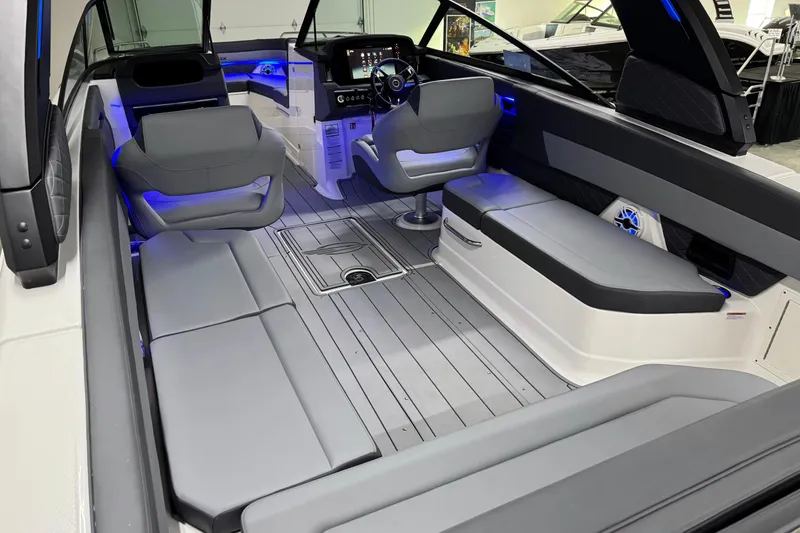 Slide: The Image of 2026 Chaparral SSX 30 boat interior with modern seating and ambient lighting. - 12