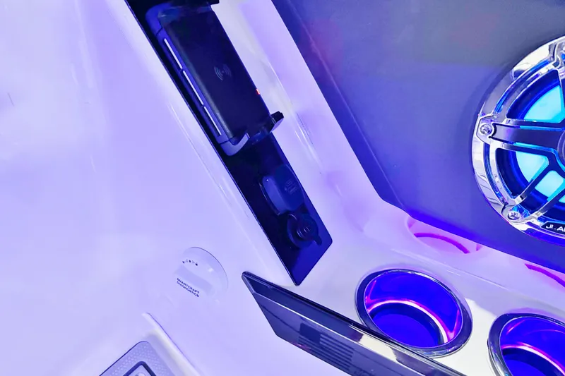 Slide: The Image of Interior of 2026 Chaparral SSX 30 with illuminated speaker and cup holders. - 19