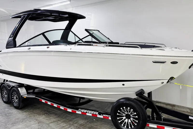 Slide: The Image of 2026 Chaparral SSX 30 boat on trailer in showroom. - 2