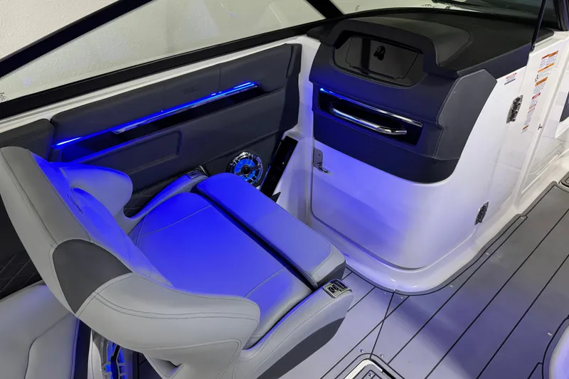 Slide: The Image of 2026 Chaparral SSX 30 interior with blue LED lighting and modern seating design. - 20