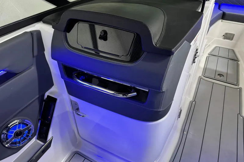 Slide: The Image of Interior of 2026 Chaparral SSX 30 boat with sleek design and blue LED lighting. - 24