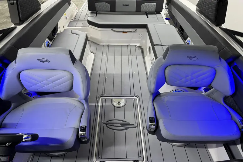 Slide: The Image of Interior of 2026 Chaparral SSX 30 boat with modern seating and blue ambient lighting. - 27