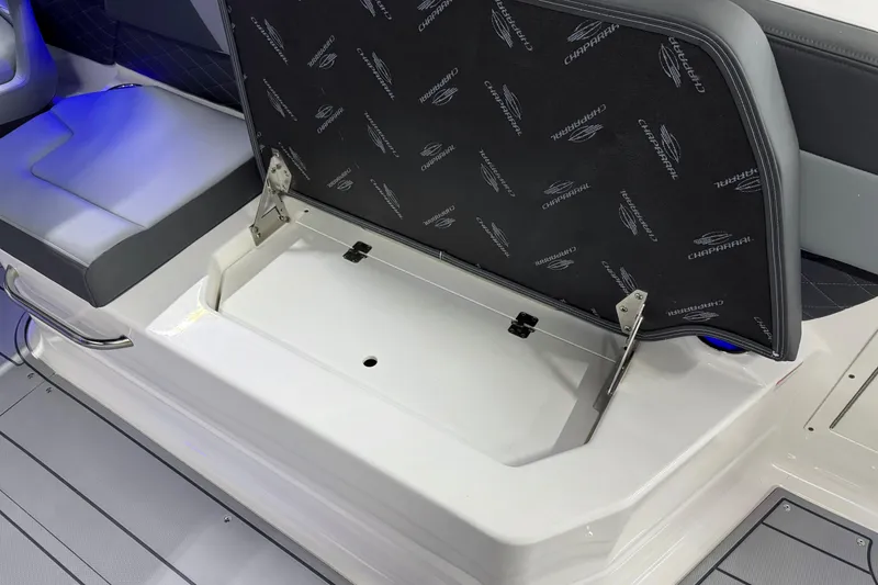Slide: The Image of 2026 Chaparral SSX 30 boat seat storage compartment with open lid. - 31