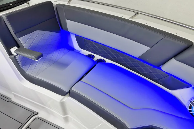 Slide: The Image of 2026 Chaparral SSX 30 boat interior with blue LED lighting and luxurious seating. - 36