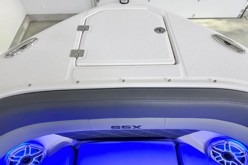 Slide: The Image of 2026 Chaparral SSX 30 boat interior with blue LED lighting and sleek design. - 40