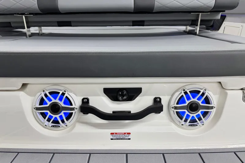 Slide: The Image of 2026 Chaparral SSX 30 boat speakers with blue LED lights and cushioned seating. - 8