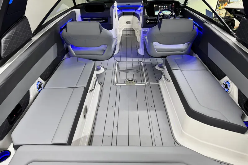 Slide: The Image of 2026 Chaparral SSX 30 boat interior with modern seating and ambient lighting. - 9