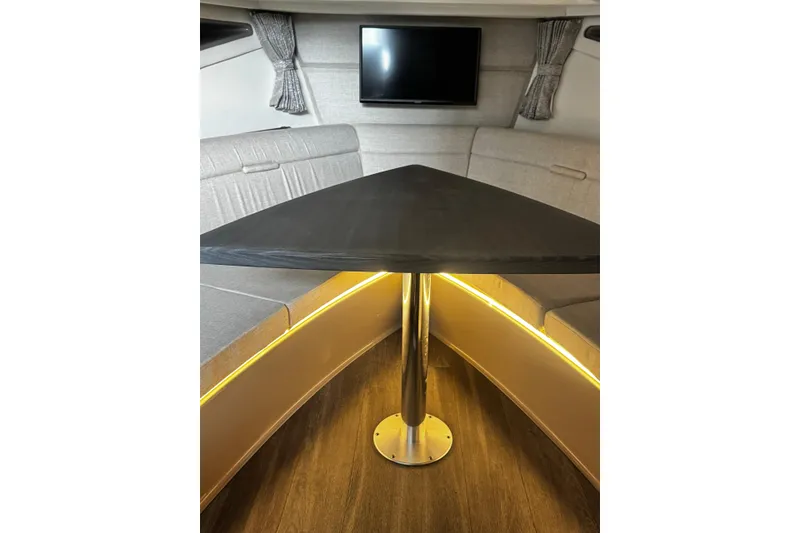 Slide: The Image of Interior of 2022 Sea Ray Sundancer 320 Outboard with modern seating and table. - 14