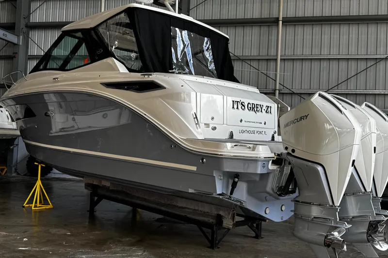 Slide: The Image of 2022 Sea Ray Sundancer 320 Outboard in a boat storage facility. - 7